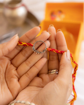 92.5 Sterling Silver Music Note Rakhi with Red-Yellow Moli Thread – Aneytri Designer Rakhi