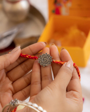 925 Silver Om Rakhi with Lotus Design on Premium Red Moli Thread – Spiritual Raksha Bandhan Gift