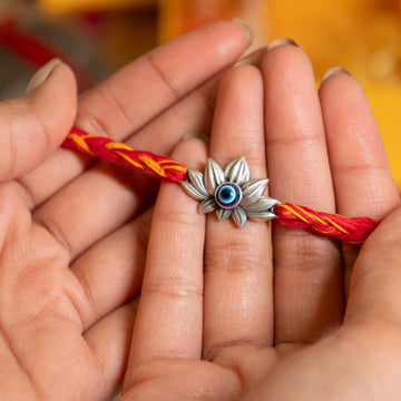 Handcrafted Evil Eye Lotus Rakhi in Silver – Premium Raksha Bandhan Gift by Aneytri