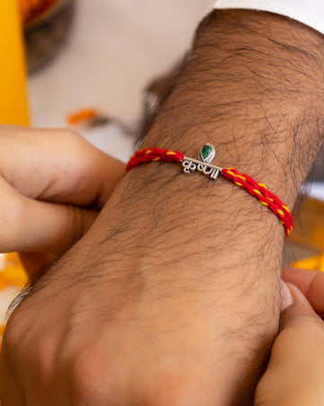 Krishna Name Rakhi in 92.5 Silver with Red-Yellow Cotton Moli – Divine Raksha Bandhan Rakhi