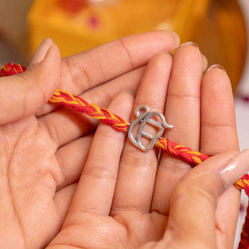 Handcrafted 92.5 Silver Ik Onkar Rakhi with Traditional Red and Yellow Thread