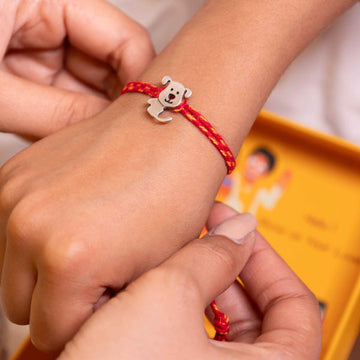 Adorable Puppy Face Kids Rakhi in 92.5 Silver on Red Thread – Child-Friendly Raksha Bandhan Design