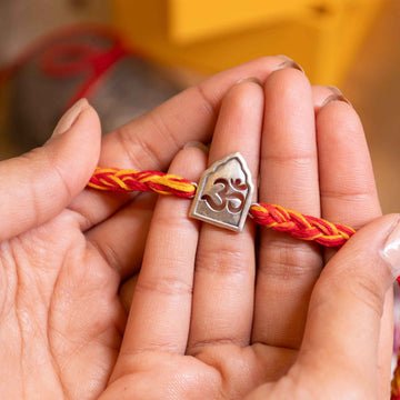 Temple Arch Om Rakhi in 92.5 Silver with Red and Yellow Thread – Spiritual Raksha Bandhan Design