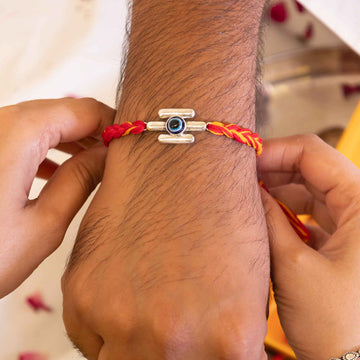 92.5 Silver Evil Eye Rakhi with Blue Center and Red Cotton Thread – Raksha Bandhan Protection Design