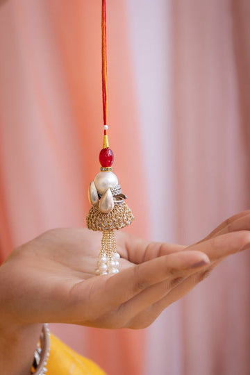 Traditional Lumba Rakhi for Bhabhi with Pearl Drops & Red Moli – Handcrafted Raksha Bandhan Accessory
