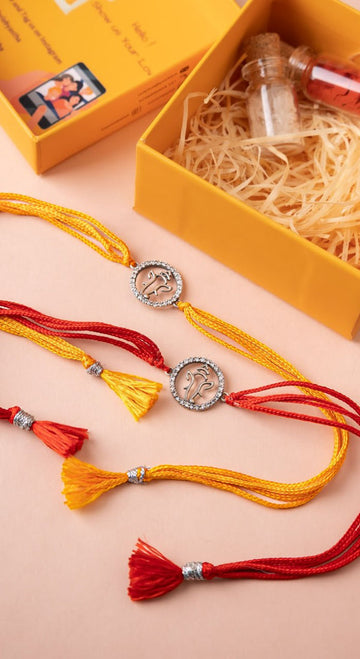 Lord Ganesha 92.5 Silver Rakhi Set with CZ Work & Moli Threads – Aneytri Raksha Bandhan Gift Box