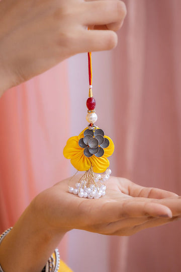 Handcrafted Floral Latkan Rakhi in Yellow with Silver Motif & Pearl Tassels – Aneytri