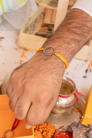 Handcrafted Silver Hindi Script Rakhi with Yellow Cotton Thread – 92.5 Silver Raksha Bandhan Design