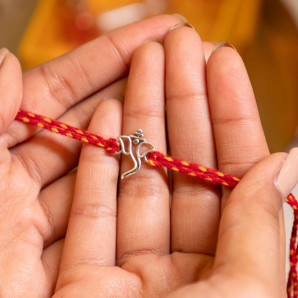 92.5 Silver Netra Evil Eye Rakhi with Red Moli Thread – Protective Designer Rakhi for Brother
