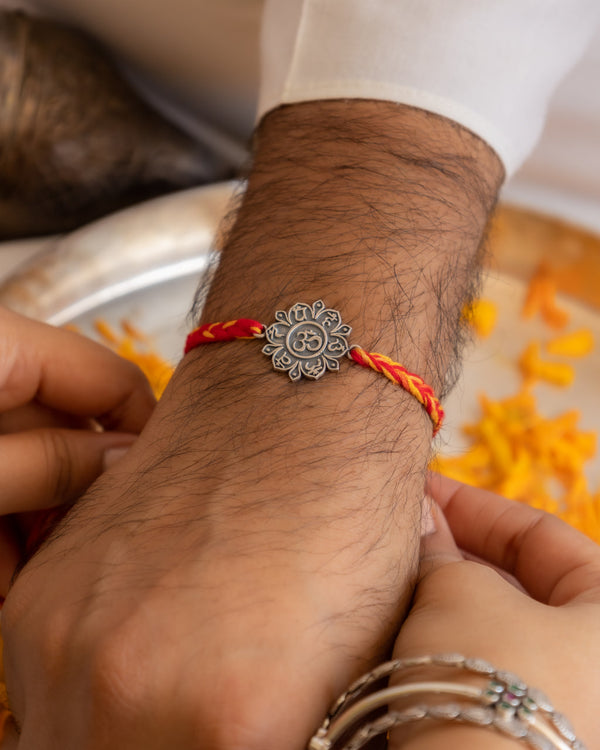 925 Silver Om Rakhi with Lotus Design on Premium Red Moli Thread – Spiritual Raksha Bandhan Gift