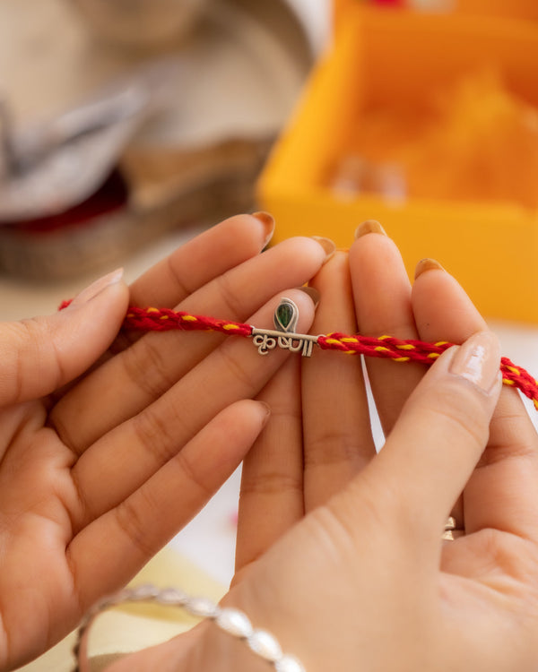 Krishna Name Rakhi in 92.5 Silver with Red-Yellow Cotton Moli – Divine Raksha Bandhan Rakhi