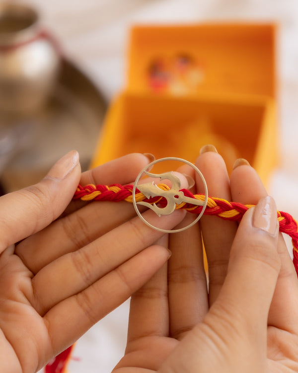 Om Rakhi in 92.5 Silver with Red & Yellow Braided Thread – Aneytri