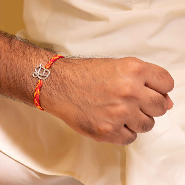 Handcrafted 92.5 Silver Ik Onkar Rakhi with Traditional Red and Yellow Thread
