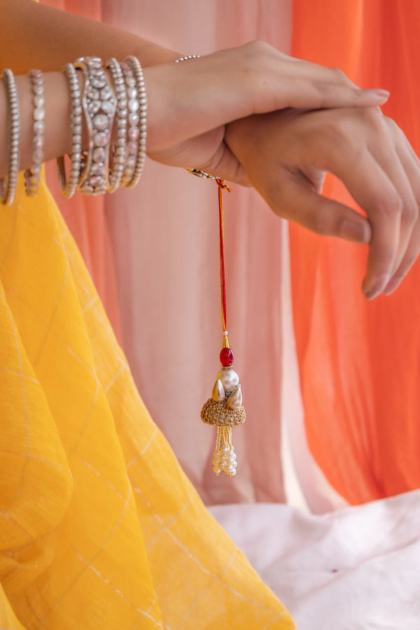 Traditional Lumba Rakhi for Bhabhi with Pearl Drops & Red Moli – Handcrafted Raksha Bandhan Accessory