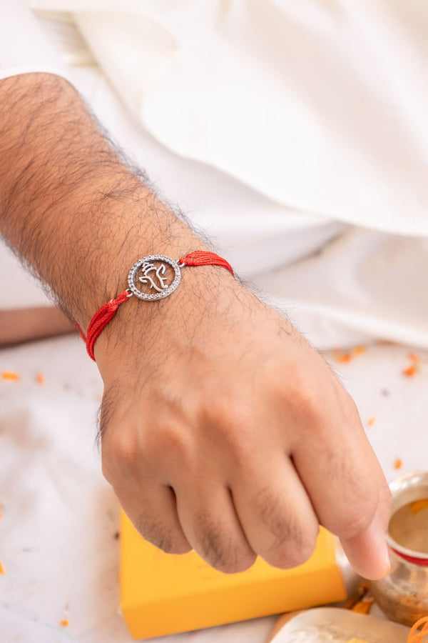 Lord Ganesha 92.5 Silver Rakhi Set with CZ Work & Moli Threads – Aneytri Raksha Bandhan Gift Box
